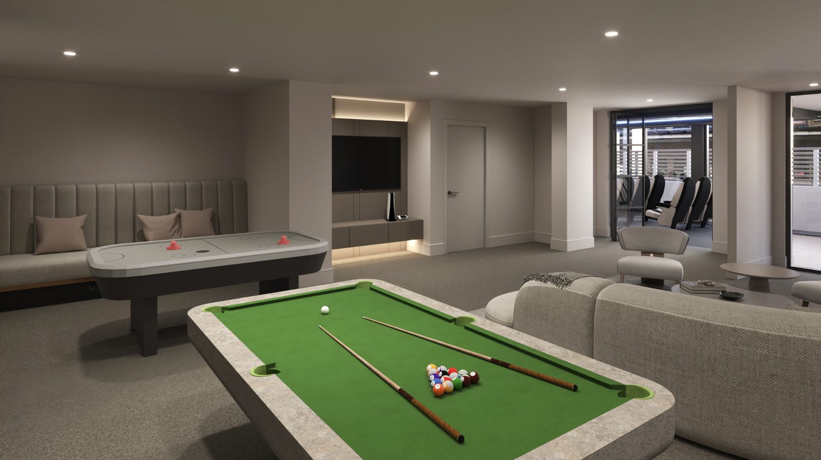 A games room with a pool table, an air hockey table, bench seating and a large television.
