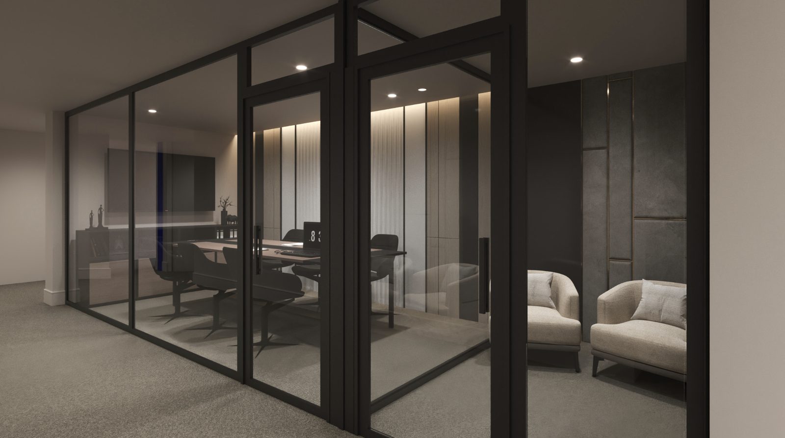 A glass-walled meeting room with a table and chairs, and two armchairs in a quiet seating area alongside.
